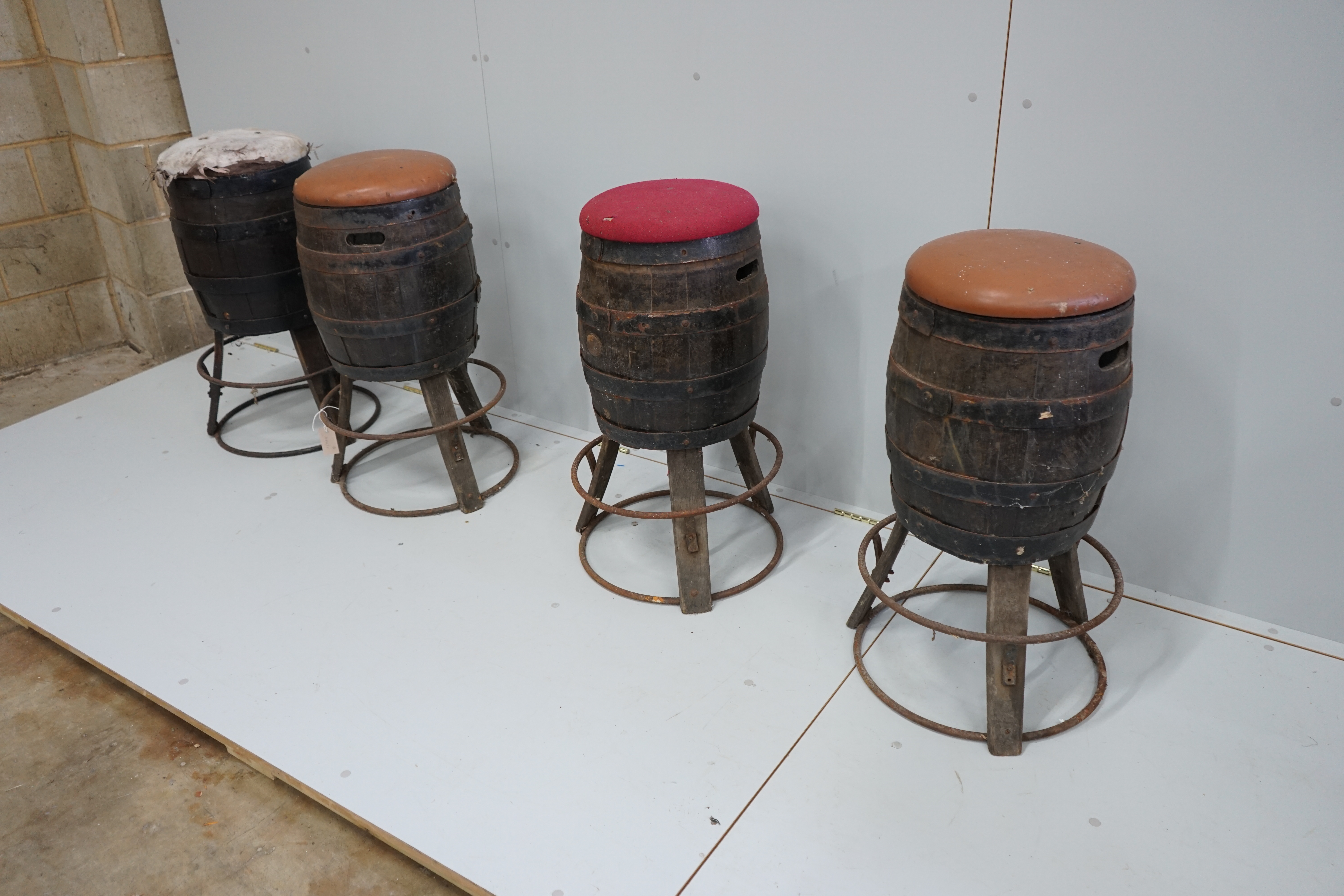 A set of four barrel bar stools, height 73cm